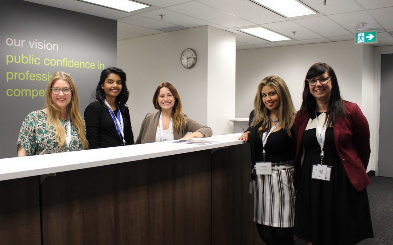Group photo in front of touchstone reception desk